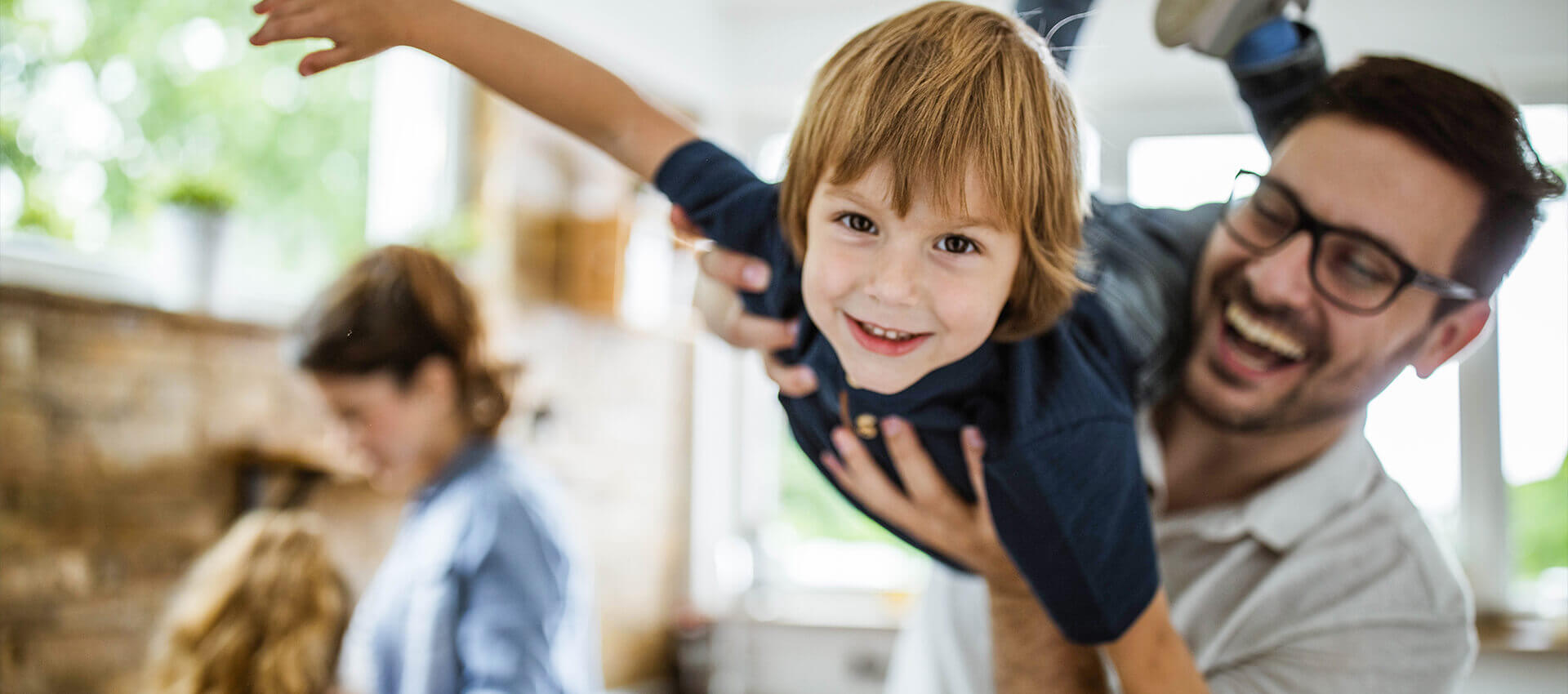 boy and his dad playing